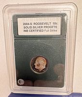 Obverse of 2004-S Roosevelt dime in INB slab showing label and grade
