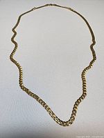 Full view of gold-tone curb chain necklace