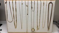 Overall view of the eight necklaces displayed on board