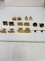Overview of all cufflink pairs on display board