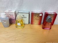 All three Entity fragrances with their respective boxes displayed on tabletop