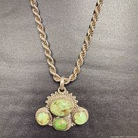 Full view of rope chain and cluster pendant