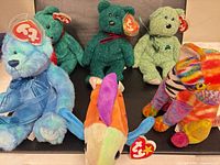 Group shot of all five Ty Beanie Babies on dark background