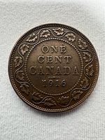 Reverse showing ONE CENT CANADA 1916 with maple leaf wreath