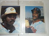 Two autographed player photos (Eddie Murray, Jim Rice) in sleeve