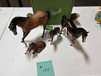 All four horse figurines with Beswick box