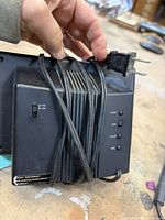 Zenith clock radio rear, FM/AM selector and wrapped AC cord visible