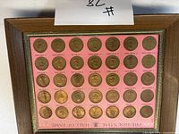 Full view of framed Presidential Hall of Fame medallion collection