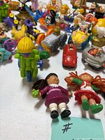 Group of assorted small toys scattered on table