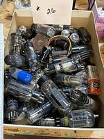 Box containing assorted vintage vacuum tubes of various brands and sizes