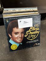 Front view of stack with "The Elvis Presley Story" LP visible