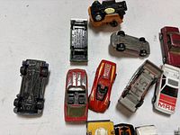 Group of cars showing undersides and tops