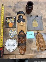 Overview of all seven items laid out with tape for scale