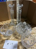 All five crystal and glass pieces grouped with ruler for scale