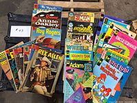 Group shot of all comics spread on trunk and pallet