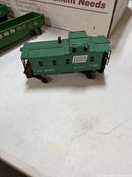 Green Penn Central caboose showing road number and condition