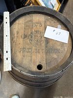 Top view showing stamp, bung hole, ruler for scale