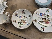 Arklow children’s mug and two plates with nursery scenes