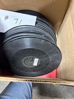 Stack of Victor 78 RPM shellac records inside cardboard box