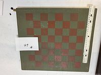 Top view showing 8x8 green and red squares with ruler for size