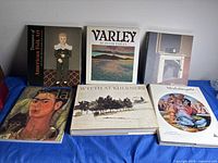 Front view of all six art books