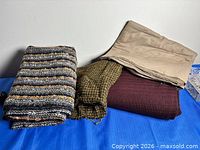 All four folded fabric pieces on table
