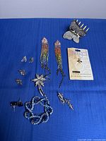 Entire lot laid out on blue fabric showing all pieces