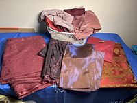 Overview of assorted fabric pieces and basket on table