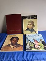 All four books front covers visible
