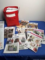 Overall lot with red file box and multiple pattern envelopes spread out