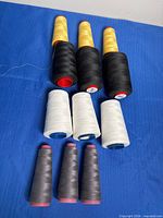 All 12 thread cones grouped by colour