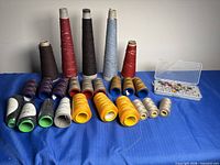 Group shot of all thread spools and bobbin case