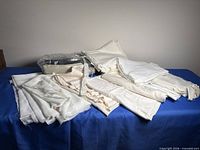 overview of all white fabric pieces spread on table