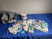 Full lot view showing zippers bag, ribbon spools, buttons, snaps, hooks & eyes, beads
