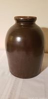 full view of brown glazed crock jar