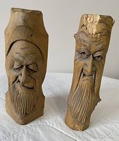 Front view of both carved wood spirit candle holders