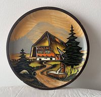 Front view of carved painted wood plate