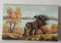 Front view of entire wood relief plaque showing moose and autumn landscape