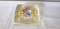 Top view of rectangular clear crystal paperweight featuring multicolour Bavarian coat of arms