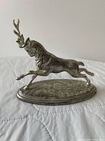 Front view of silver stag figurine