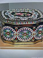 Side view showing mosaic bead pattern and overall shape