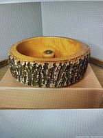 Top/side view showing full wooden nut bowl with bark exterior