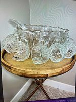 punch bowl with ladle and cups displayed