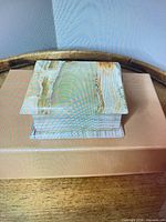 Closed onyx box on display showing color and shape