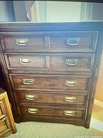 Front view showing drawer arrangement and brass hardware