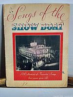 Front cover showing title and riverboat image