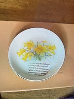 Front view showing daffodil design and poem text