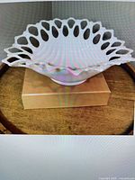 Front view showing oval bowl profile and open lace rim