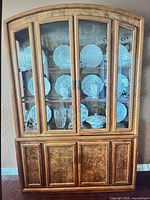 Full front view of china cabinet showing glass doors and lower cabinets