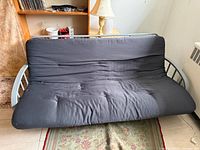 Front view of futon showing full width and fabric condition